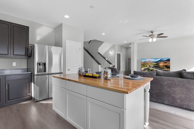 7 Erin Hills Rd, Commercial Point, OH 43116 - kitchen featuring stainless steel fridge, butcher block countertops, wood finished floors, open floor plan, and a ceiling fan