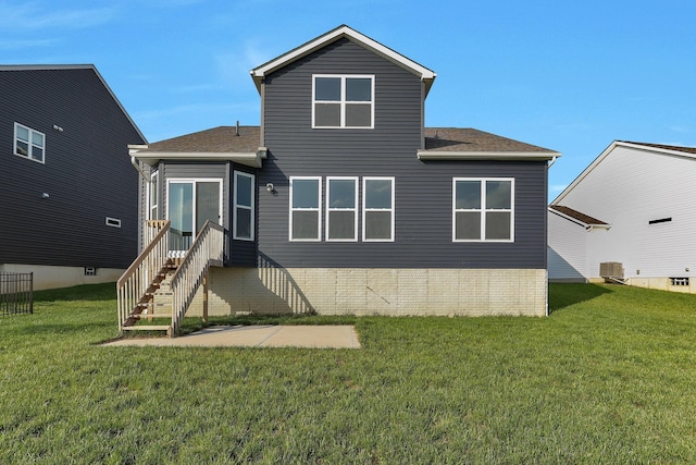 7 Erin Hills Rd, Commercial Point, OH 43116 - back of house featuring a lawn, a shingled roof, and cooling unit
