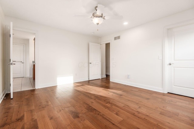 4175 Bangle Ct, Dublin, OH 43016 - unfurnished bedroom featuring baseboards, recessed lighting, ensuite bathroom, visible vents, and hardwood / wood-style floors
