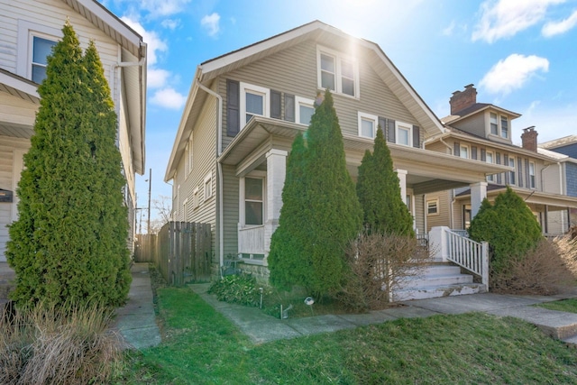 1542 S 4th St, Columbus, OH 43207 - view of front of home with fence, covered porch, and a front lawn