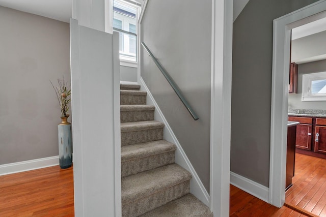 1542 S 4th St, Columbus, OH 43207 - staircase featuring wood finished floors, plenty of natural light, and baseboards