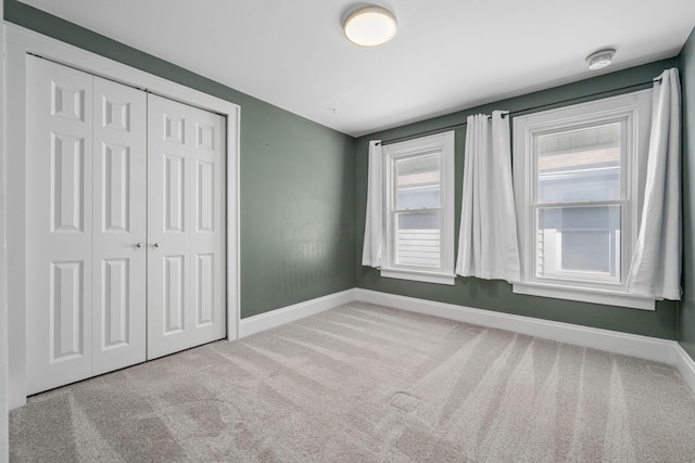1542 S 4th St, Columbus, OH 43207 - unfurnished bedroom with a closet, carpet, and baseboards