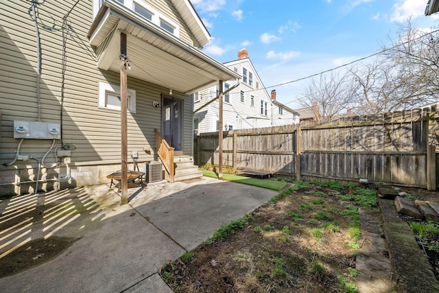 1542 S 4th St, Columbus, OH 43207 - view of exterior entry featuring fence, a patio area, and central air condition unit