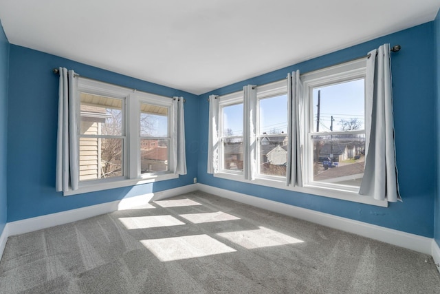 1542 S 4th St, Columbus, OH 43207 - empty room featuring baseboards, carpet, and plenty of natural light