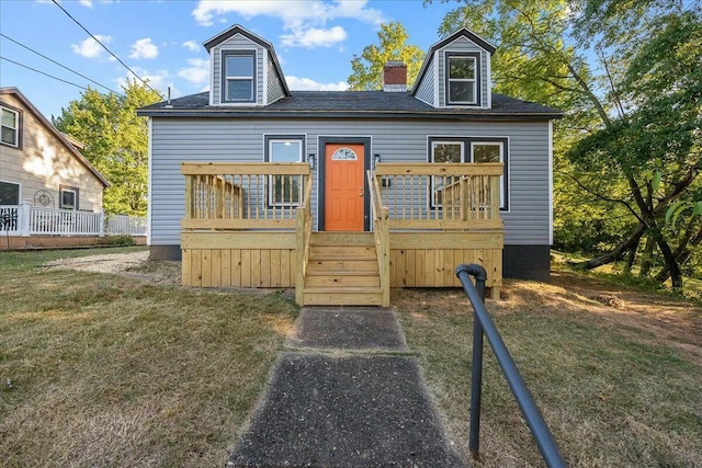 126 W Spring St, Marietta, OH 45750 - cape cod house with a deck, a front lawn, and a chimney
