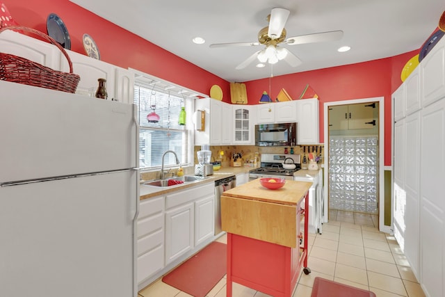 123 Campbell St, Delaware, OH 43015 - kitchen featuring wooden counters, white cabinetry, a sink, and appliances with stainless steel finishes