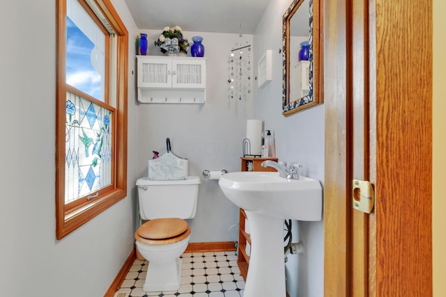 123 Campbell St, Delaware, OH 43015 - half bath with baseboards, toilet, and a sink