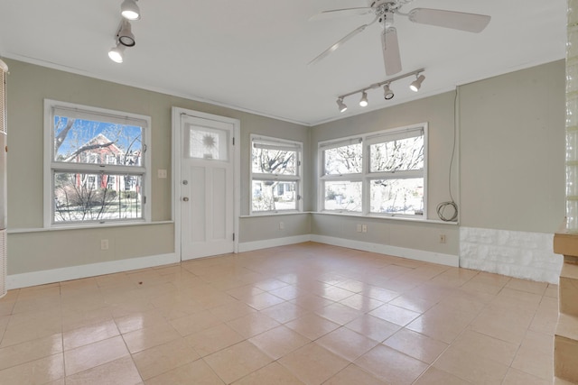 123 Campbell St, Delaware, OH 43015 - foyer entrance featuring a ceiling fan, ornamental molding, tile patterned floors, and baseboards