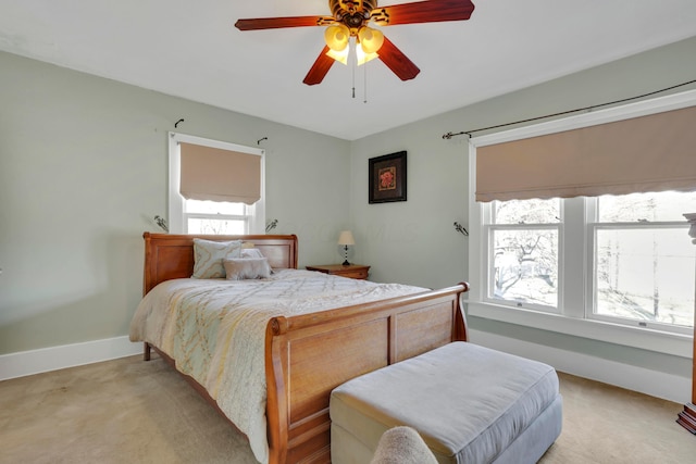 123 Campbell St, Delaware, OH 43015 - bedroom with light carpet, baseboards, and ceiling fan
