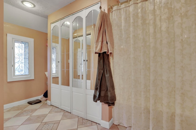123 Campbell St, Delaware, OH 43015 - entrance foyer with baseboards, light tile patterned floors, and a textured ceiling
