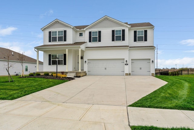 traditional-style house with driveway, fence, a garage, a front lawn, and a porch