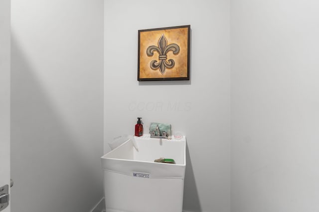 bathroom featuring a soaking tub