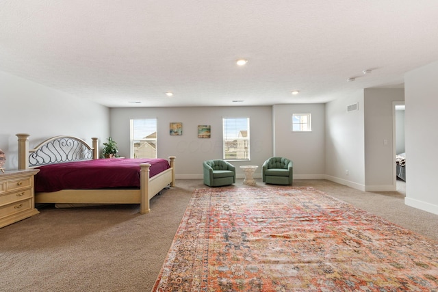 bedroom featuring light carpet, a textured ceiling, baseboards, visible vents, and recessed lighting