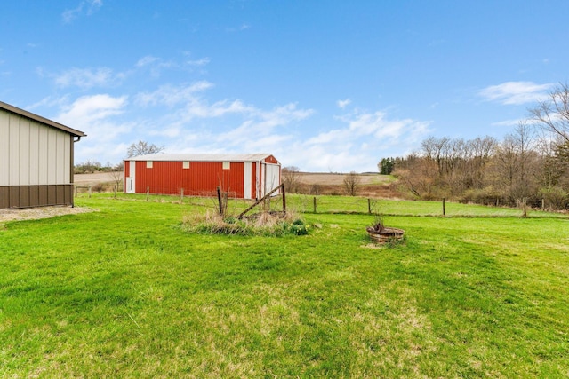 14963 Payne Rd, Marysville, OH 43040 - view of yard featuring fence, a pole building, a garage, a rural view, and an outdoor structure