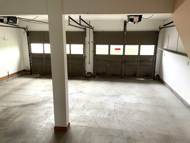 14963 Payne Rd, Marysville, OH 43040 - garage featuring baseboards and a garage door opener