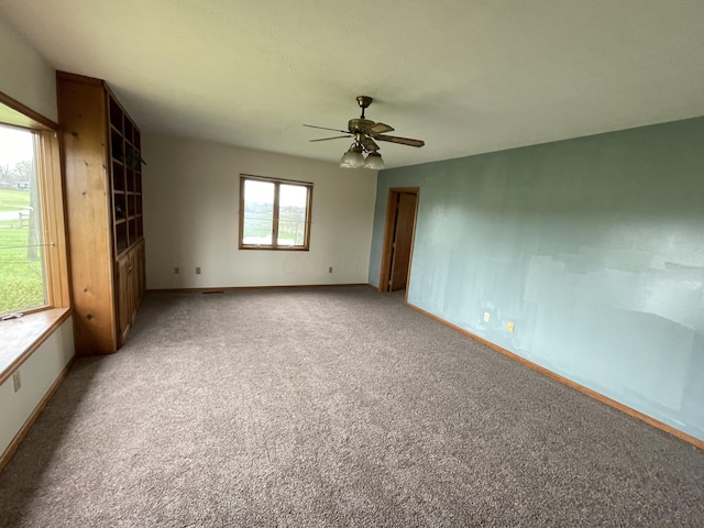 14963 Payne Rd, Marysville, OH 43040 - spare room featuring light carpet, baseboards, and a ceiling fan