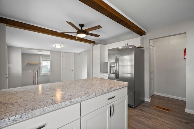 kitchen featuring light countertops, white cabinets, a ceiling fan, beam ceiling, and stainless steel fridge with ice dispenser