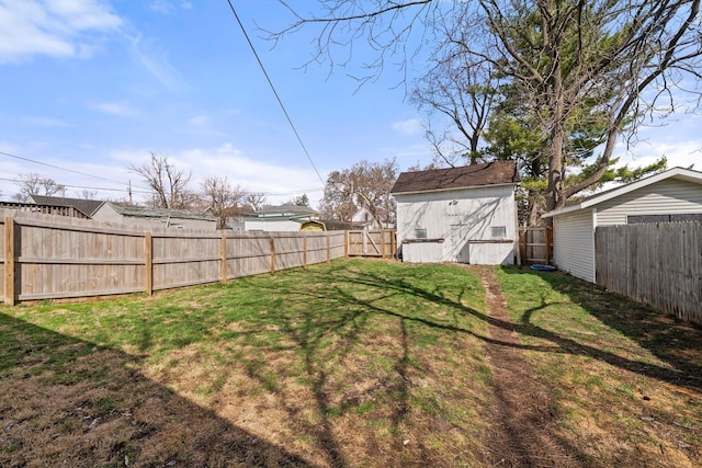 view of yard featuring an outbuilding and a fenced backyard