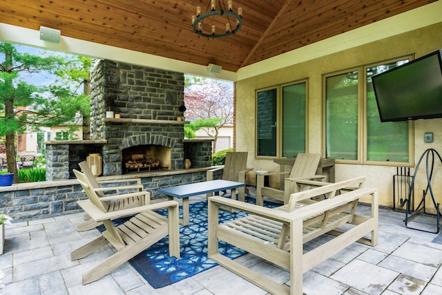 view of patio / terrace with an outdoor stone fireplace