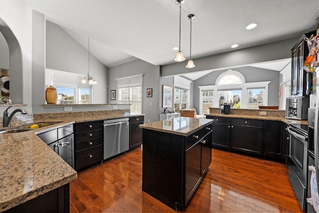 4600 Hirth Hill Rd E, Grove City, OH 43123 - kitchen with lofted ceiling, a sink, a peninsula, and appliances with stainless steel finishes