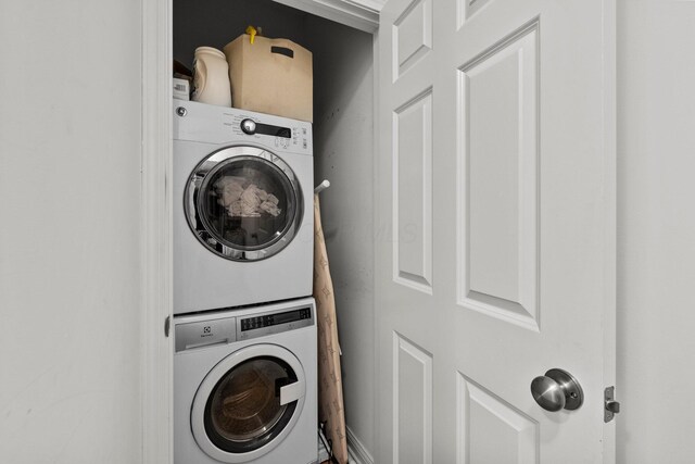 4600 Hirth Hill Rd E, Grove City, OH 43123 - laundry room featuring stacked washer / dryer and laundry area