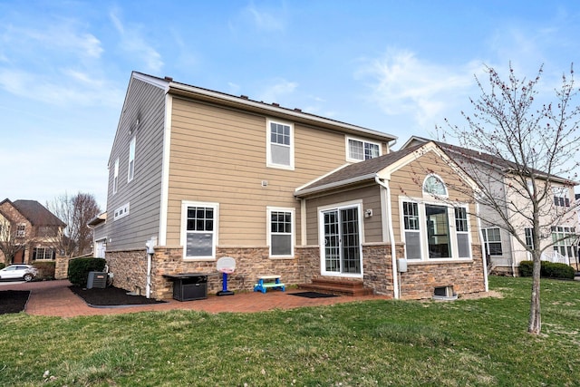 4600 Hirth Hill Rd E, Grove City, OH 43123 - rear view of house with a patio area, entry steps, stone siding, and a yard