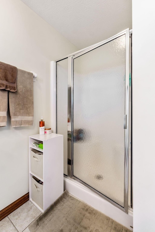 bathroom featuring a stall shower