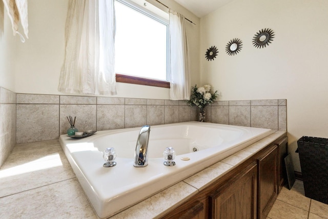 full bath with tile patterned floors and a jetted tub