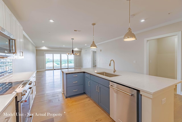 5177 Highpointe Lakes Dr Unit 9403, Westerville, OH 43081 - kitchen featuring white cabinetry, light wood-type flooring, a chandelier, a sink, and appliances with stainless steel finishes