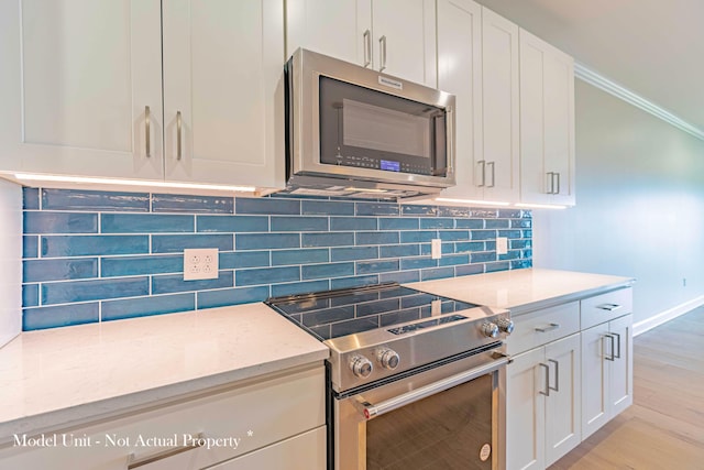 5177 Highpointe Lakes Dr Unit 9403, Westerville, OH 43081 - kitchen featuring tasteful backsplash, light stone counters, white cabinets, and stainless steel appliances