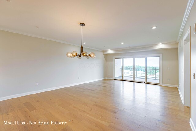 5177 Highpointe Lakes Dr Unit 9403, Westerville, OH 43081 - unfurnished room featuring light wood finished floors, baseboards, ornamental molding, and a chandelier