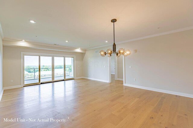 5177 Highpointe Lakes Dr Unit 9403, Westerville, OH 43081 - spare room featuring baseboards, a notable chandelier, light wood-style floors, and crown molding