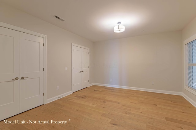 5177 Highpointe Lakes Dr Unit 9403, Westerville, OH 43081 - empty room featuring baseboards, visible vents, and light wood-type flooring