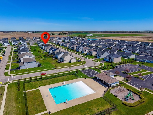 birds eye view of property with a residential view