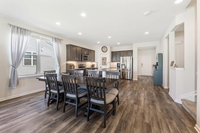 dining room with recessed lighting, baseboards, and dark wood-style floors