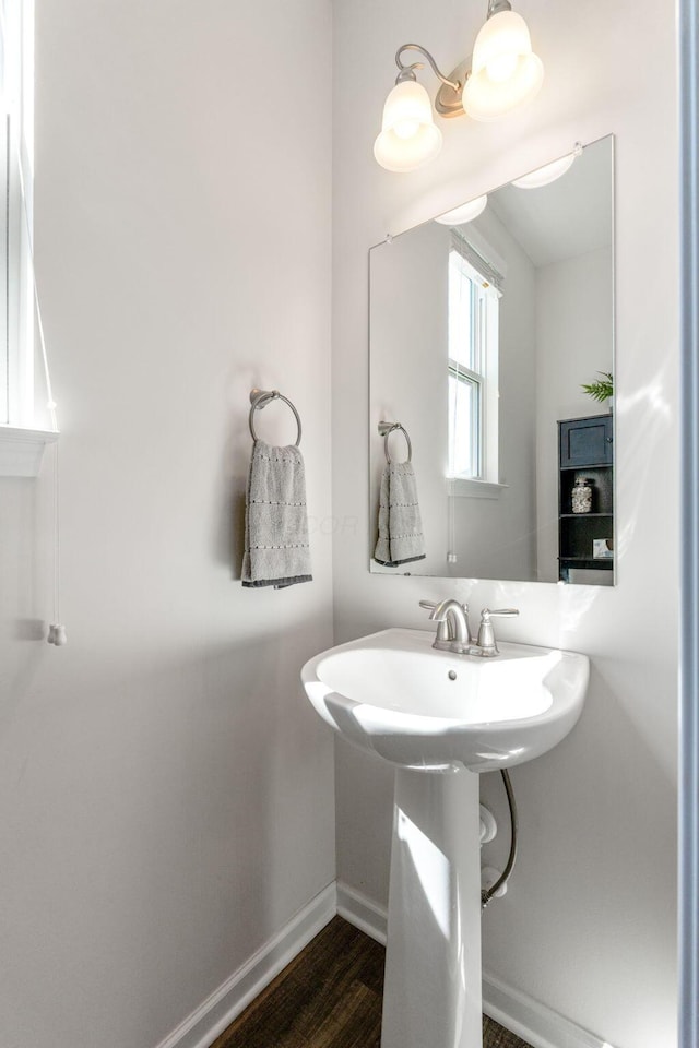 bathroom featuring baseboards and wood finished floors