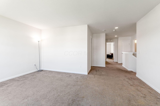 unfurnished room featuring carpet floors, recessed lighting, and baseboards