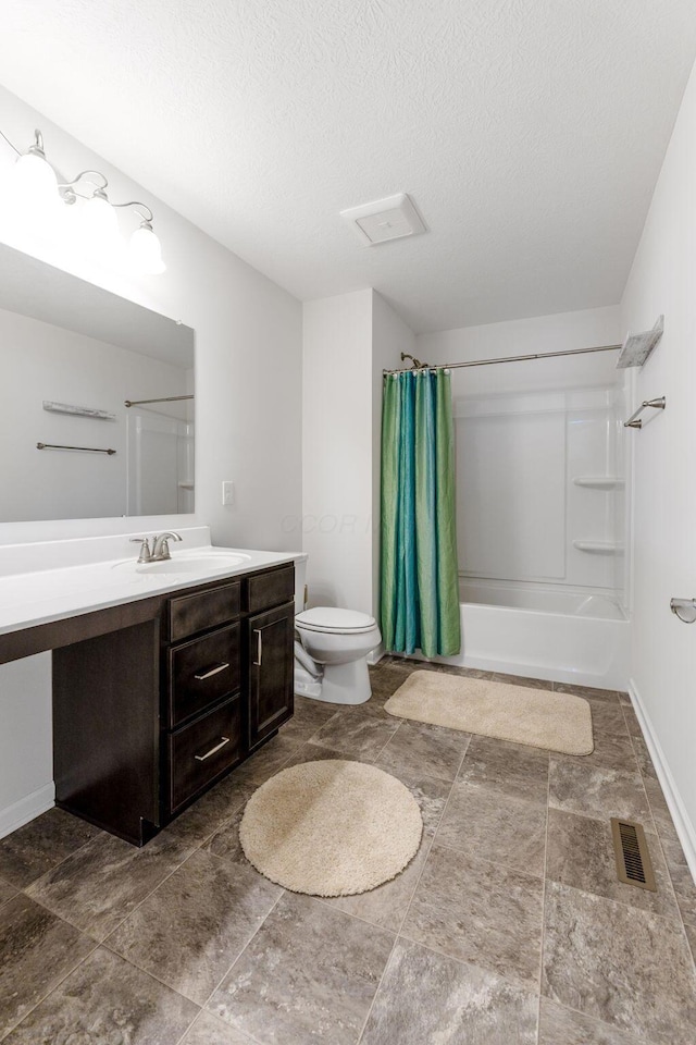 bathroom featuring visible vents, shower / bath combo, vanity, baseboards, and toilet