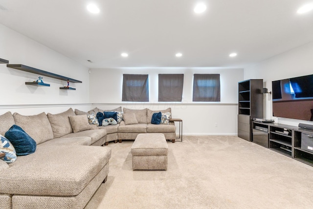 living area featuring baseboards, carpet flooring, and recessed lighting