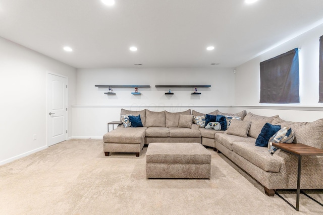 carpeted living room with recessed lighting and baseboards