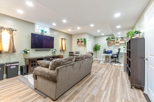 living area with recessed lighting, baseboards, and light wood-style floors