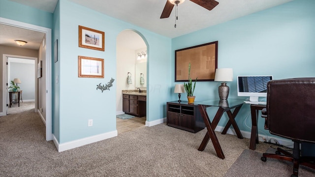 116 Coffeetree Ct, Pickerington, OH 43147 - office area featuring light colored carpet, a sink, ceiling fan, and arched walkways