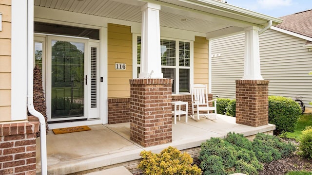 116 Coffeetree Ct, Pickerington, OH 43147 - view of exterior entry with a porch and brick siding