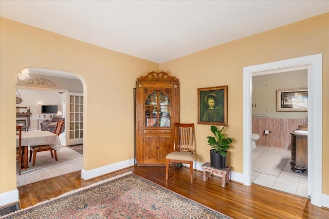 8056 Summit Rd SW, Pataskala, OH 43062 - sitting room with arched walkways, wood finished floors, and visible vents