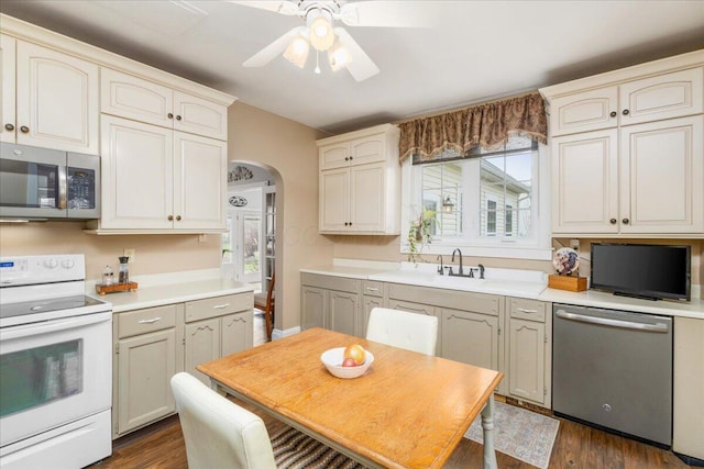 8056 Summit Rd SW, Pataskala, OH 43062 - kitchen with stainless steel appliances, arched walkways, a healthy amount of sunlight, and ceiling fan