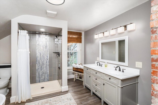 8056 Summit Rd SW, Pataskala, OH 43062 - full bathroom featuring a sink, toilet, a shower stall, and wood finished floors
