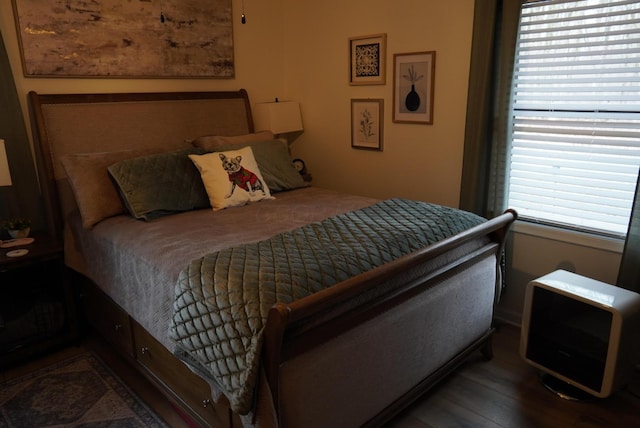 bedroom featuring wood finished floors