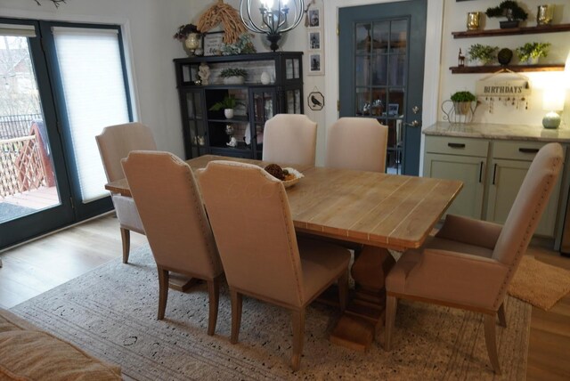 dining space featuring light wood-style floors