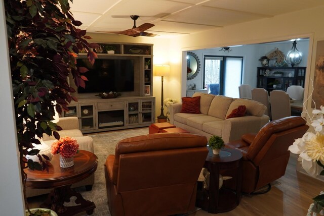 living area featuring wood finished floors and a ceiling fan