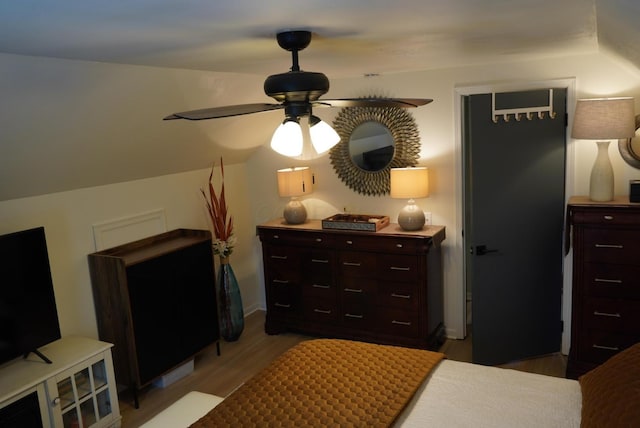 bedroom with light wood-style floors and a ceiling fan